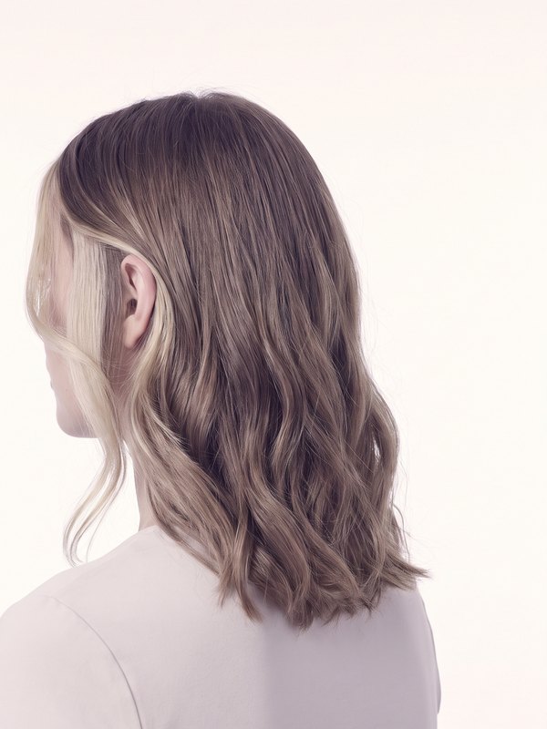 Back view of finished colour: soft lightened pieces through a darker blonde base.